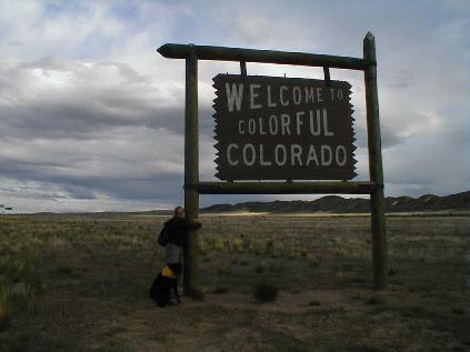 A random tourist hugging a sign